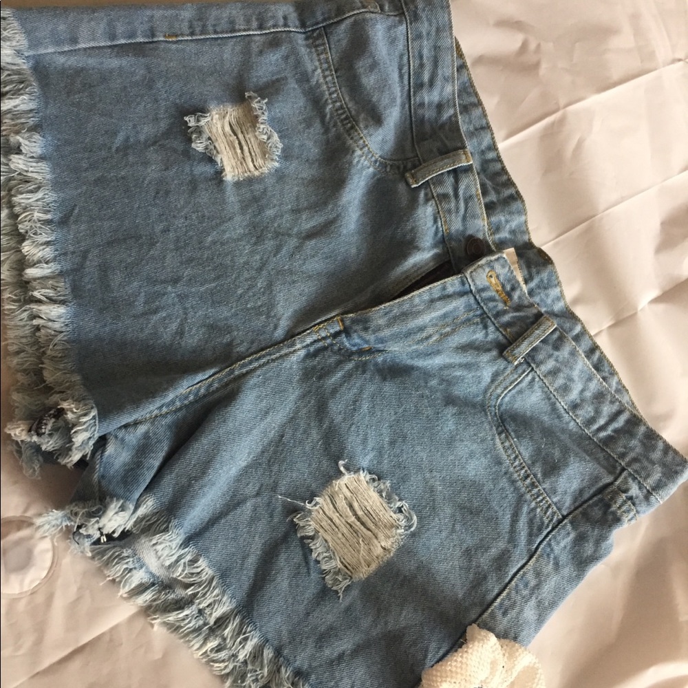 Blue ripped jean shorts